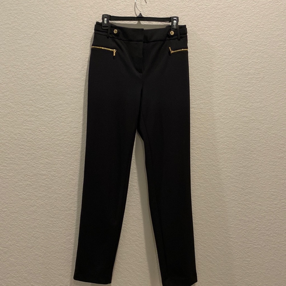 Calvin Klein black slacks. Great condition. Tapered leg. Gold metal details.